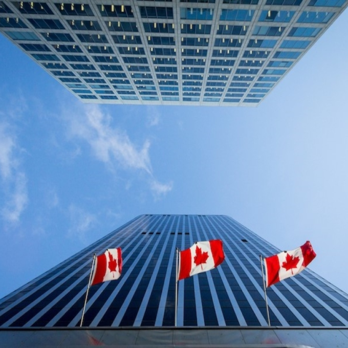 Bank of Canada office buildings with three Canadian flags