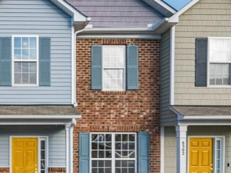 Two houses with yellow doors and mortgages up for renewal