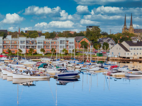 Marina filled with sailboats and recreational boats along the Charlottetown waterfront on a sunny day.